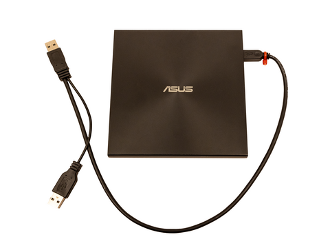 Disc drive with USB cable to attach to other devices.
